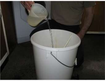 adding brewing water to the fermenter
